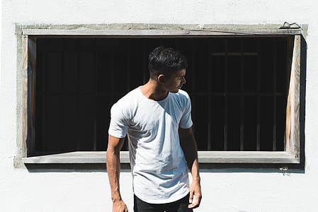 man standing in front of the window thumbnail