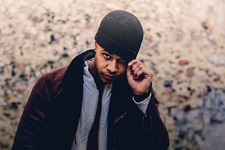 man holding black beanie thumbnail