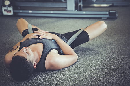 man lying on gray rug thumbnail