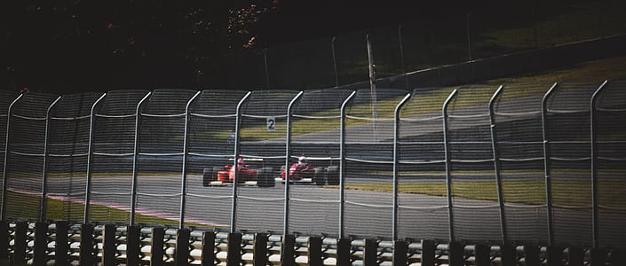 red vehicles at daytime thumbnail
