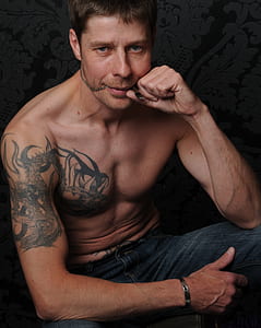 man in blue jeans having photo thumbnail
