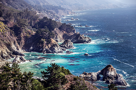 aerial photography of mountains near the ocean thumbnail