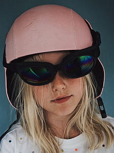 girl wearing pink helmet and glasses thumbnail