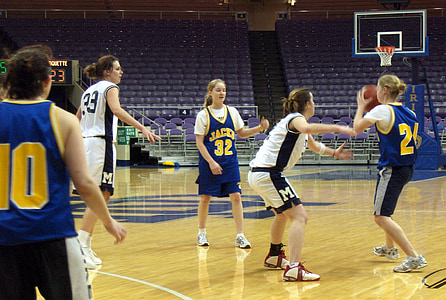 girls playing basketball inside court thumbnail
