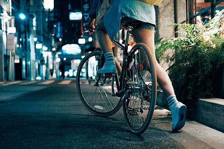woman riding black bicycle thumbnail