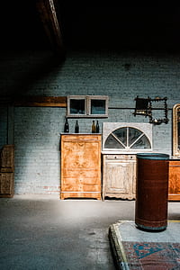 brown wooden armoire with four bottles on top thumbnail