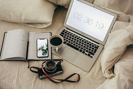 white ceramic mug on MacBook Air thumbnail
