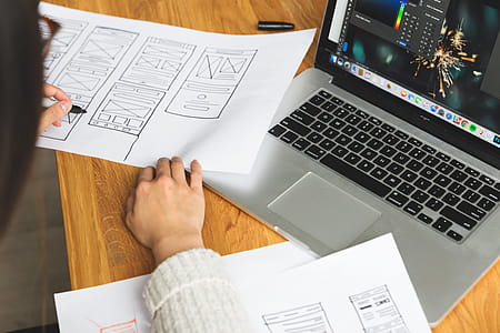 Female Designer Reviewing Web Wireframes Photo thumbnail