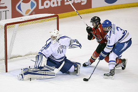 three men playing ice hockey thumbnail