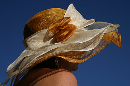 woman wearing white and brown sun hat thumbnail