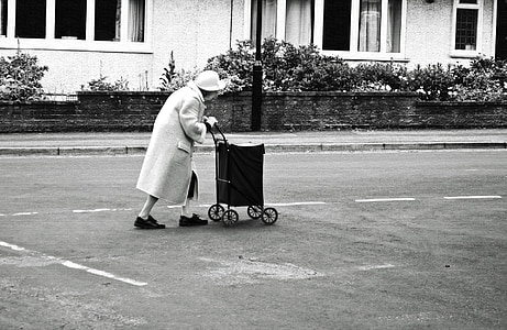 woman holding cart on road thumbnail
