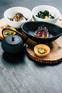 food on bowl near teapot thumbnail
