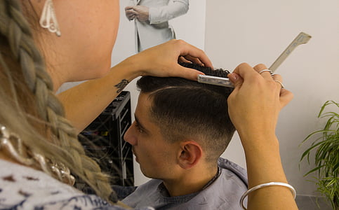 woman dressing man's hair thumbnail