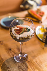 clear stemmed glass filled with dessert selective focus photography thumbnail