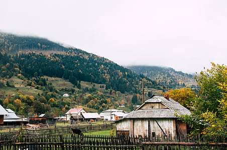 houses at the foot of mountain during daytime thumbnail