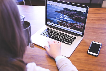 person drinking tea in front of MacBook Pro thumbnail