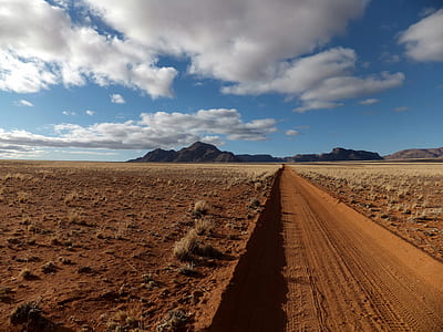 Brown Sandy Field Under Blue and White Cloudy Sky thumbnail