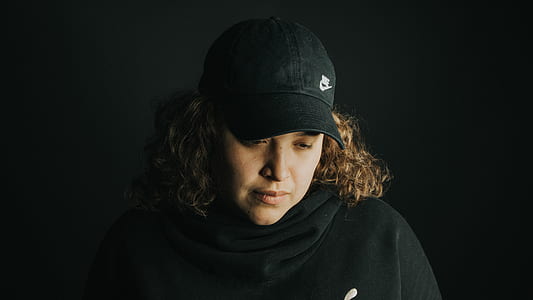 woman wearing black Nike cap thumbnail