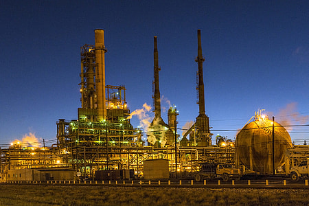 nuclear plant surrounded by metal chain fence under dark blue sky thumbnail