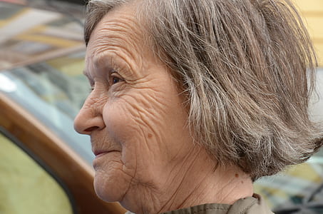 smiling woman wearing brown top thumbnail