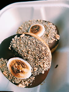 chocolate coated doughnut on white bowl thumbnail