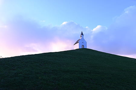 white and brown building on top of the hill thumbnail