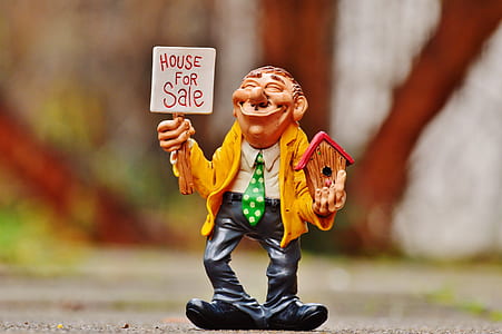 tilt shift photography of brown haired man figurine thumbnail