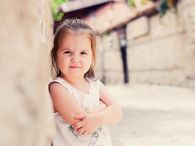 girl wearing white sleeveless top thumbnail