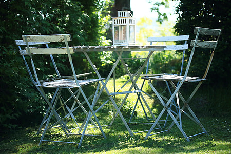 white wooden table with four chairs thumbnail