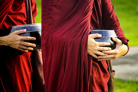 person wearing red robe carrying black pot collage thumbnail
