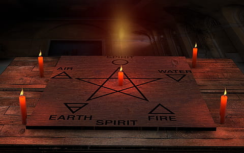 six element and star draw on board beside four candles thumbnail
