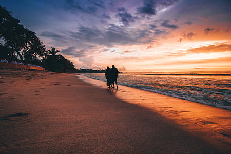 Two People Walking On The Seashore thumbnail