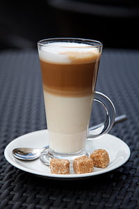 brown liquid in cup with sugar blocks thumbnail