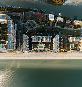 Aerial Photography of High-rise Tower Near the Body of Water thumbnail