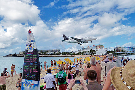 people taking photo of white and black plane thumbnail