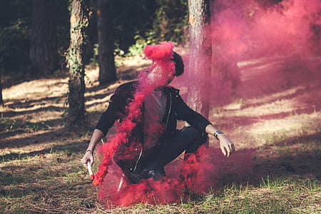 man in black shirt holding red container thumbnail