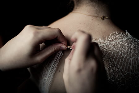 Person Buttoning White Shirt thumbnail