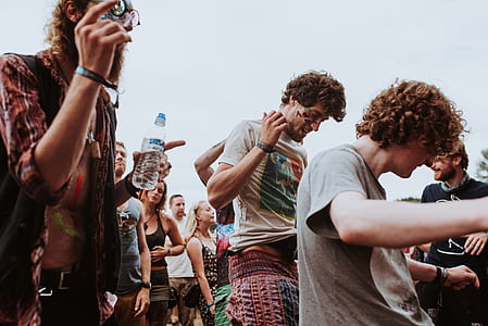people dancing around under cloudy sky thumbnail