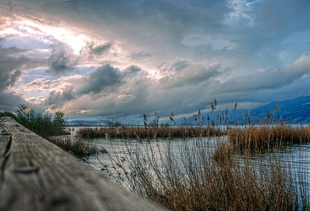 lake with cloudy sky thumbnail
