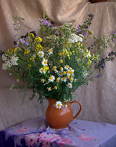 assorted flowers on brown ceramic pitcher plant pot thumbnail