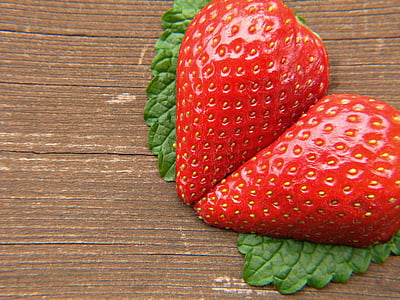 food photography of sliced strawberry on top of brown surface thumbnail