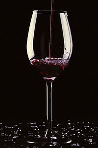 clear wine glass filled with red wine thumbnail