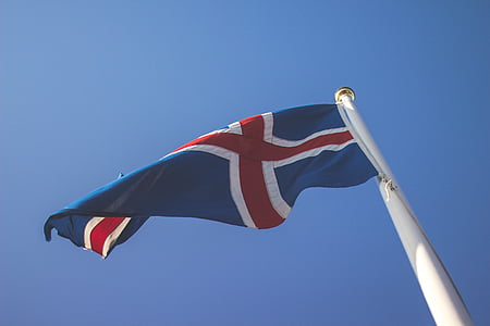 blue, red, and white flag on flag pole thumbnail