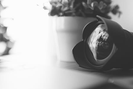 Black and White. Detail of lens with reflections in the glass thumbnail