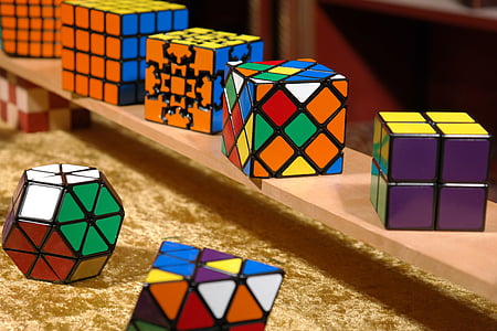 assorted-color-and-shape Rubik's cube lot on shelf thumbnail