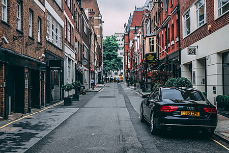 black Audi car travelling at the road thumbnail