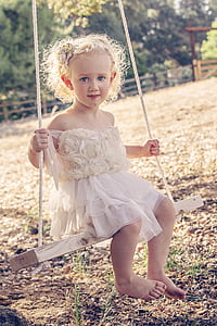 girl sitting on swing thumbnail