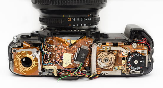 Black Dslr Camera Showing Its Circuit Board thumbnail