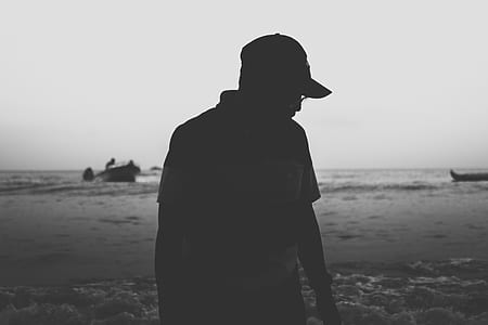 silhouette of person wearing fitted cap thumbnail