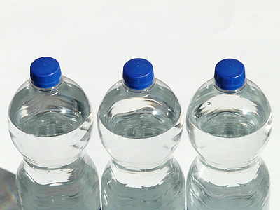 shallow photography of three clear plastic bottles thumbnail